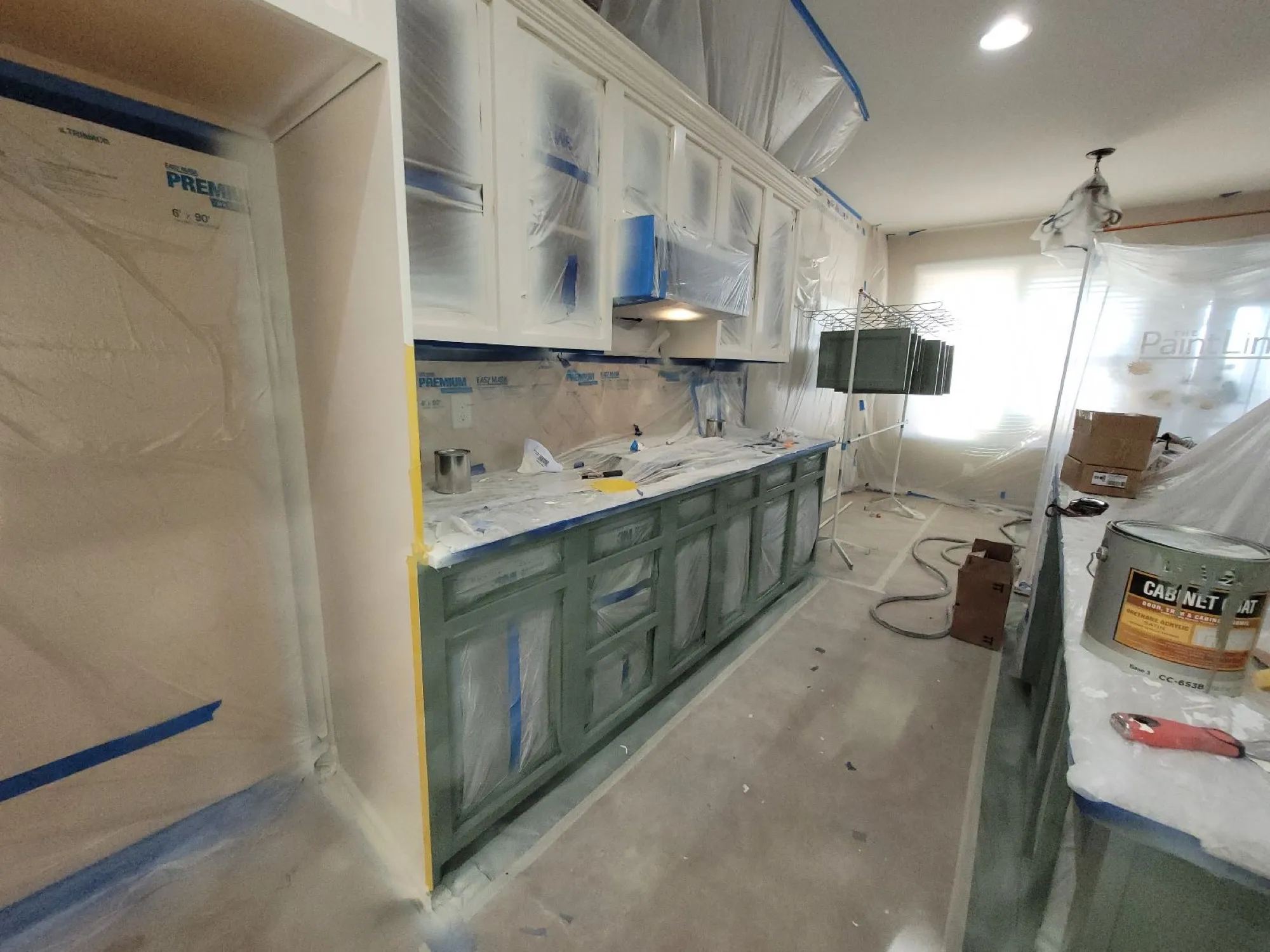 Panda Painting crew prepping cabinets on the job in Spring Hill, TN